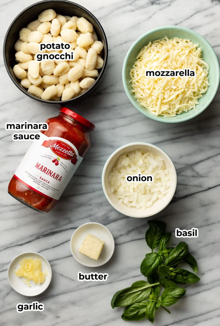 ingredients for baked gnocchi in small bowls on a counter