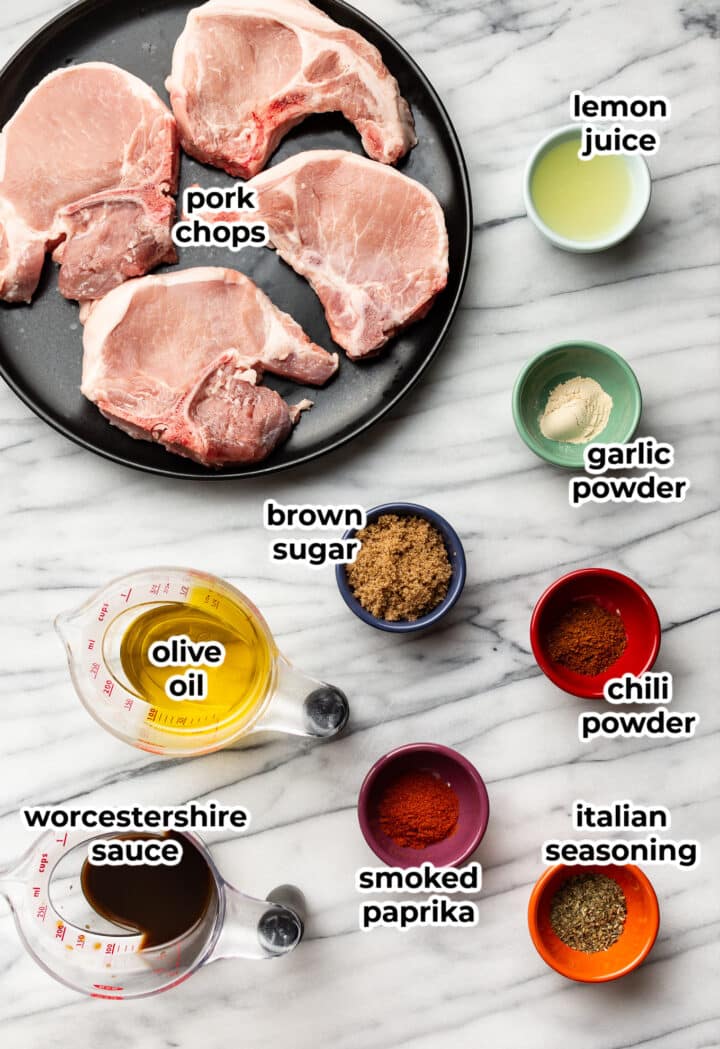 ingredients for grilled pork chops and marinade in bowls