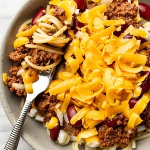 a bowl of cincinnati chili with a fork