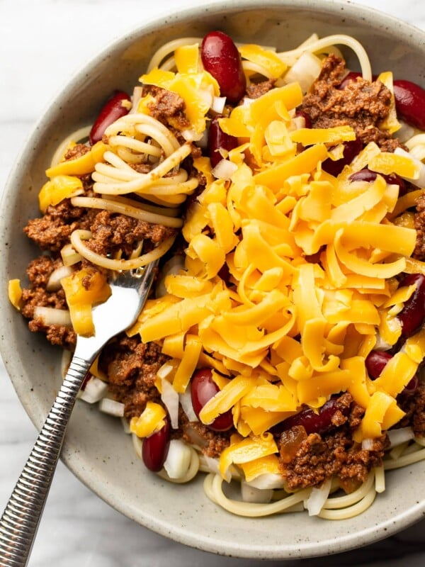 a bowl of cincinnati chili with a fork