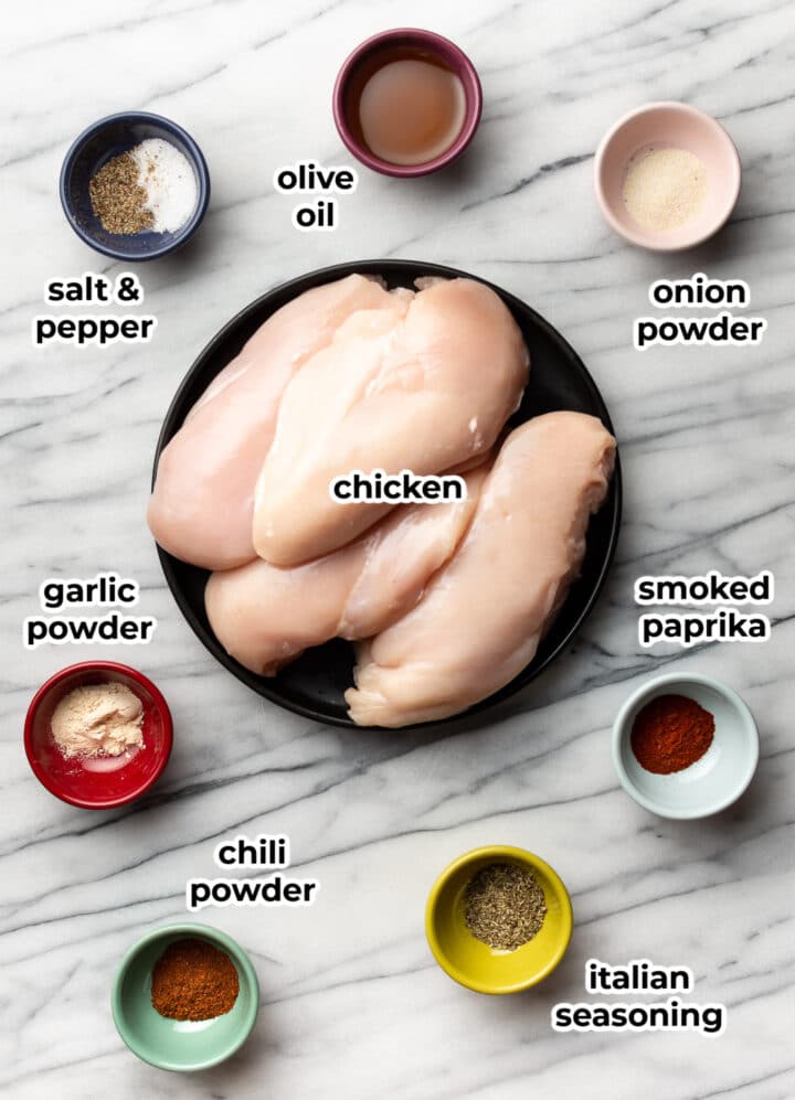 ingredients for baked chicken breast in prep bowls