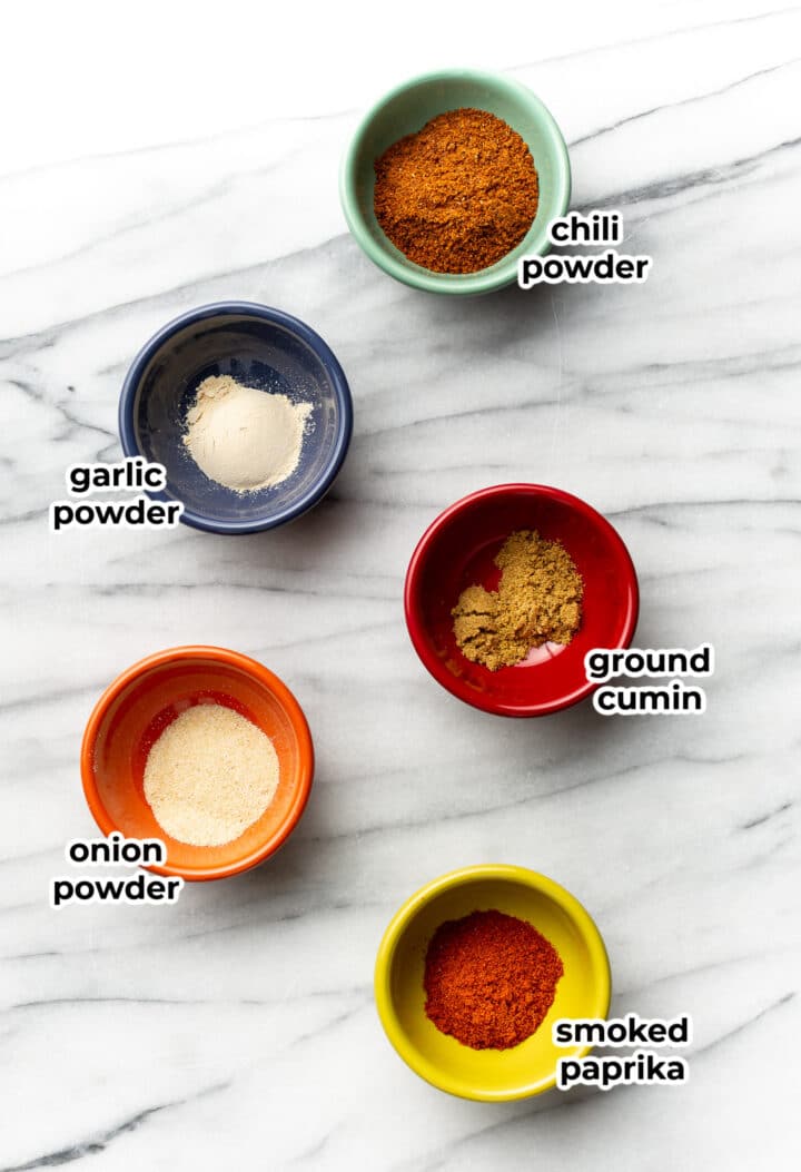 small bowls with ingredients for taco seasoning