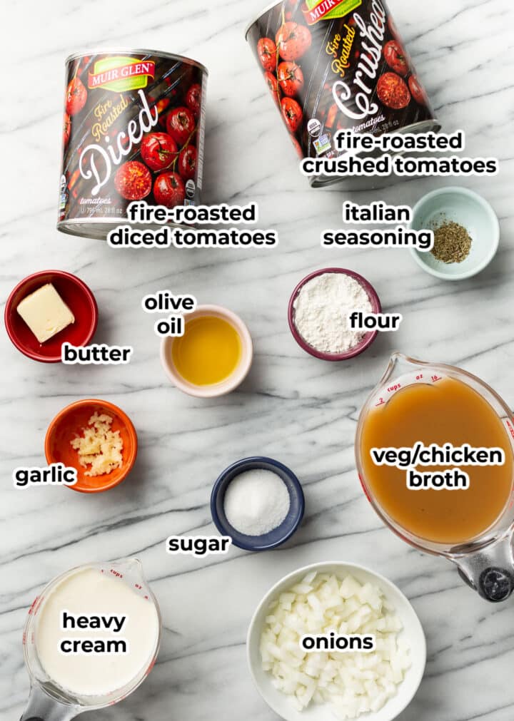 ingredients for homemade tomato soup on a counter