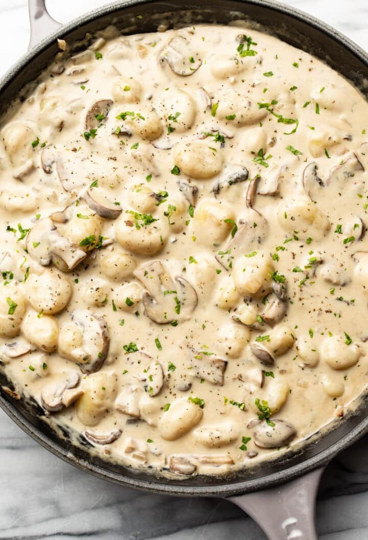 a skillet with creamy boursin and mushroom gnocchi