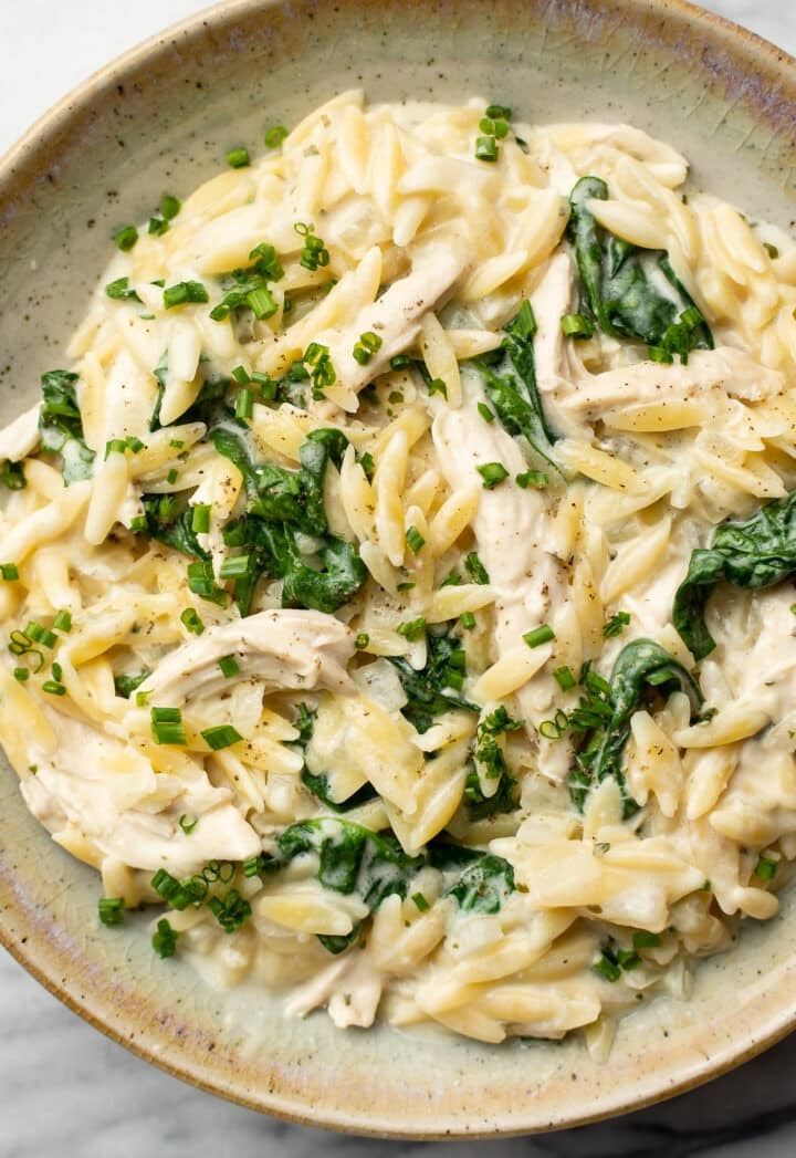 a bowl of boursin orzo with chicken