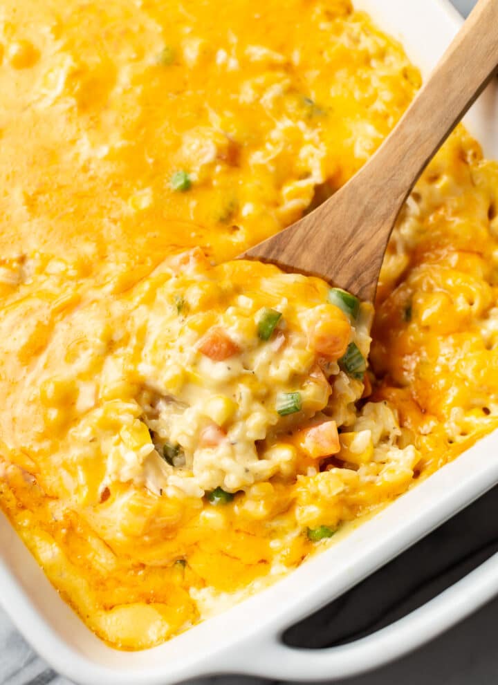 a serving spoon with chicken and rice casserole