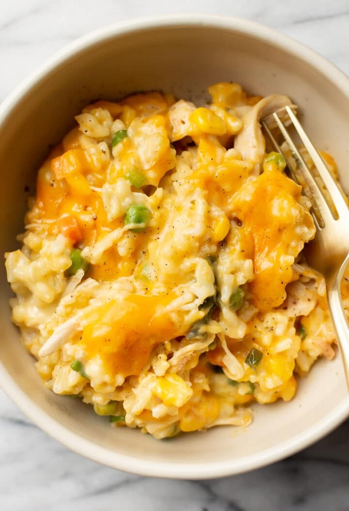 a bowl with a portion of chicken and rice casserole