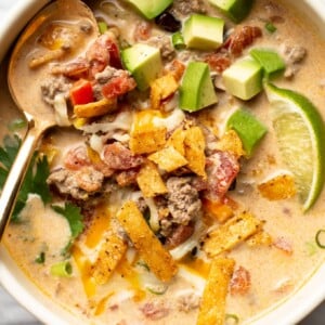 a bowl of creamy taco soup with a spoon