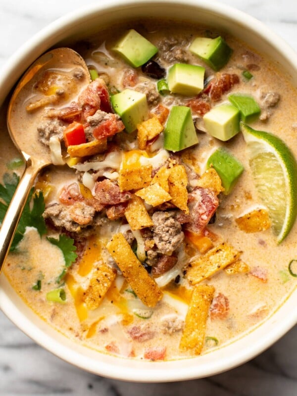 a bowl of creamy taco soup with a spoon