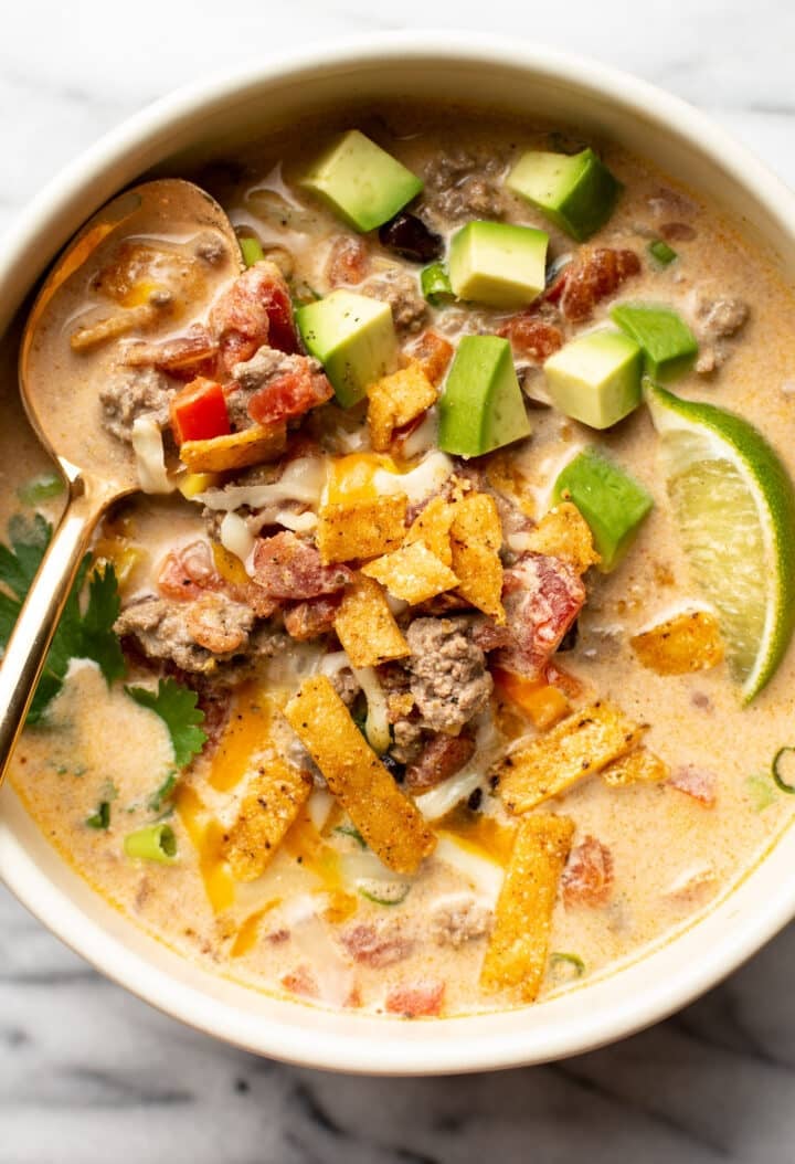 a bowl of creamy taco soup with a spoon