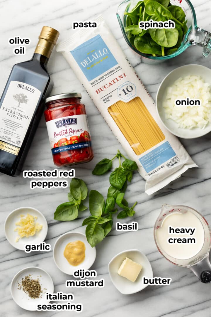 ingredients for creamy roasted red pepper pasta on a counter