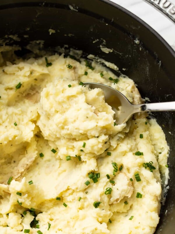 closeup of boursin mashed potatoes with a whisk