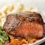 filet mignon on a plate with mashed potatoes