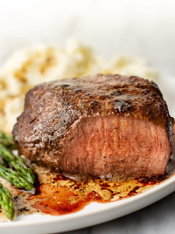 filet mignon on a plate with mashed potatoes