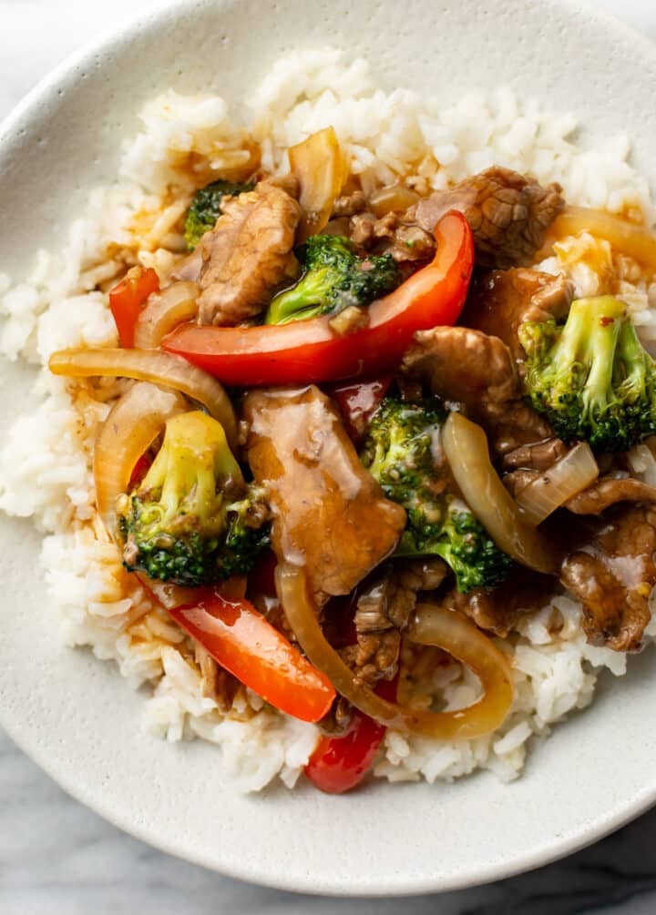 a bowl of beef stir fry with rice