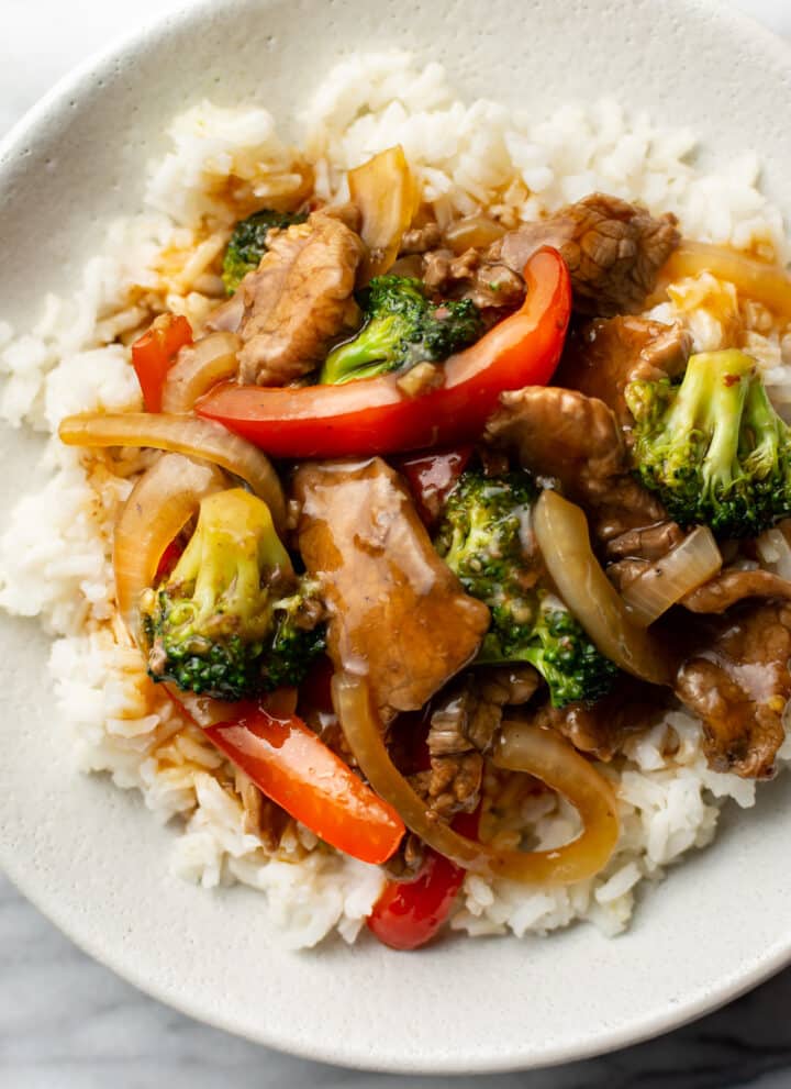 a bowl of beef stir fry with rice