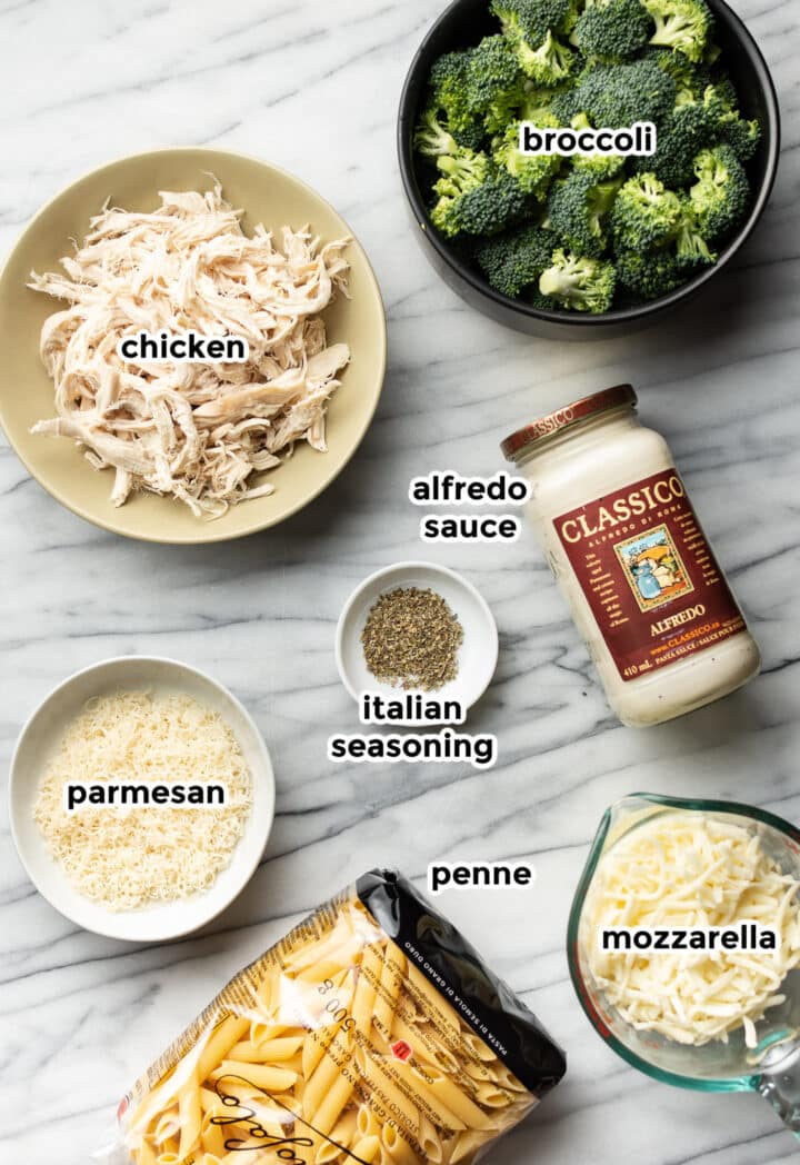 ingredients for chicken alfredo broccoli bake in prep bowls