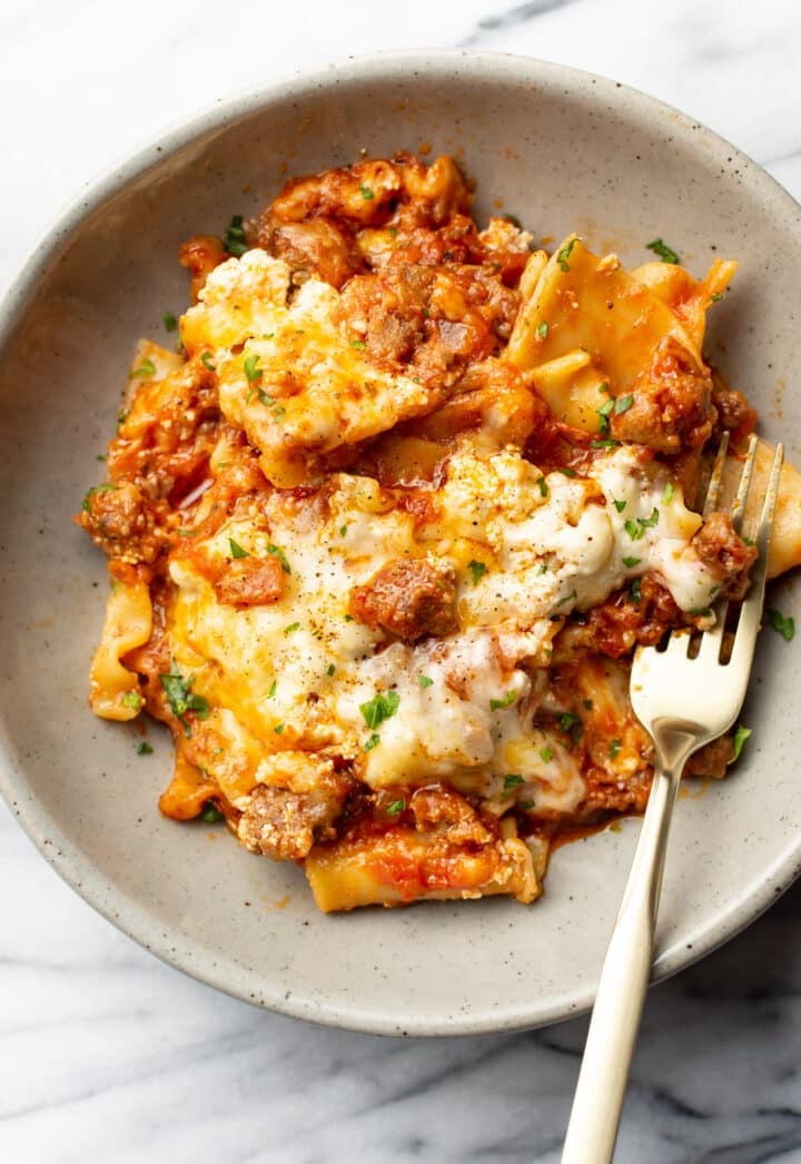 a bowl with skillet lasagna and a fork