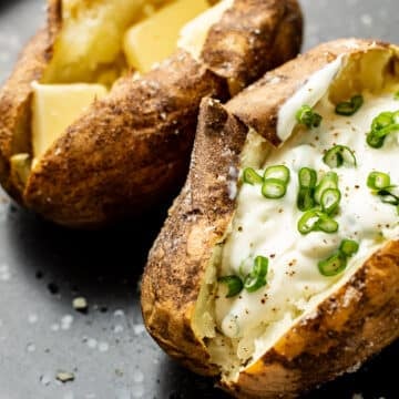 two baked potatoes on a plate