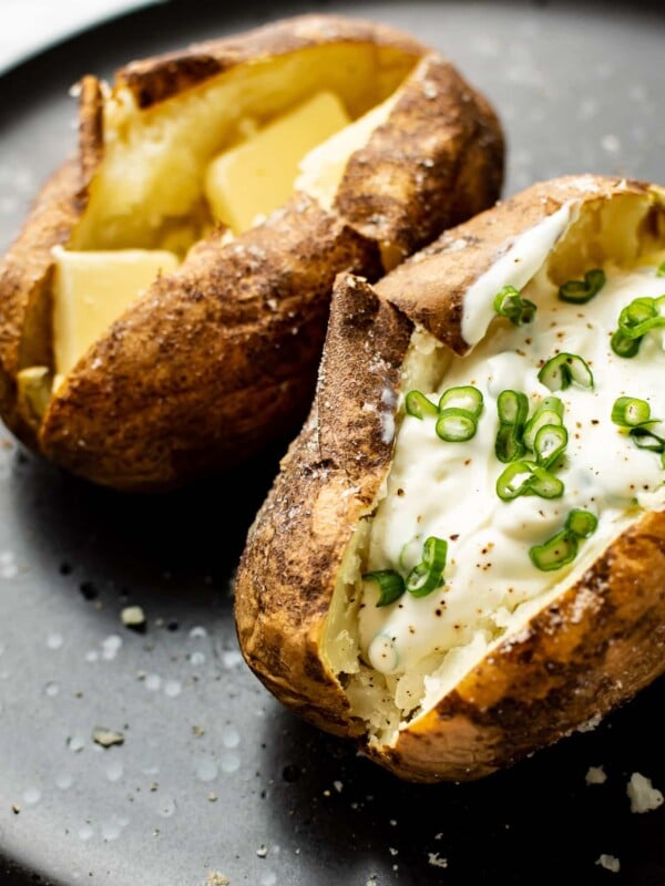 two baked potatoes on a plate