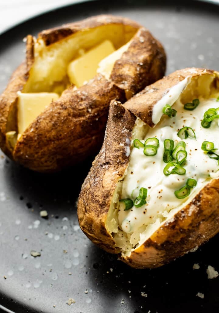 two baked potatoes on a plate