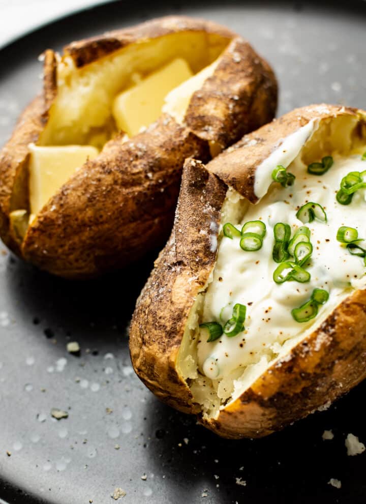 two baked potatoes on a plate