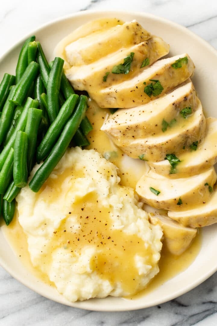 a plate with honey mustard chicken, green beans, and mashed potatoes