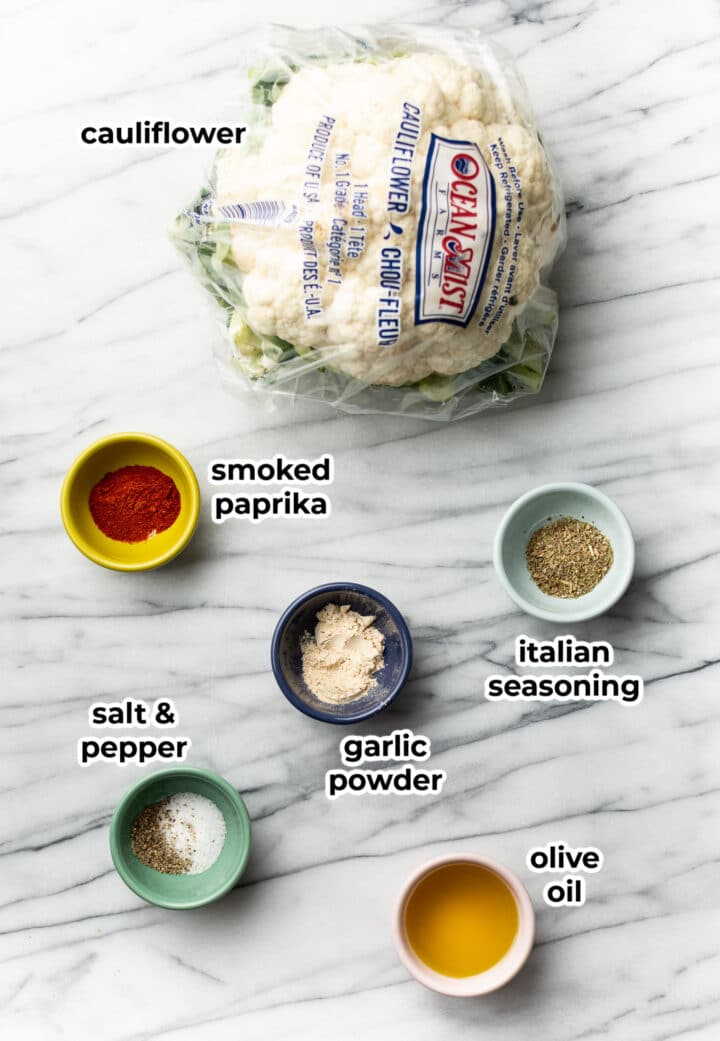 ingredients for oven roasted cauliflower in prep bowls on a counter