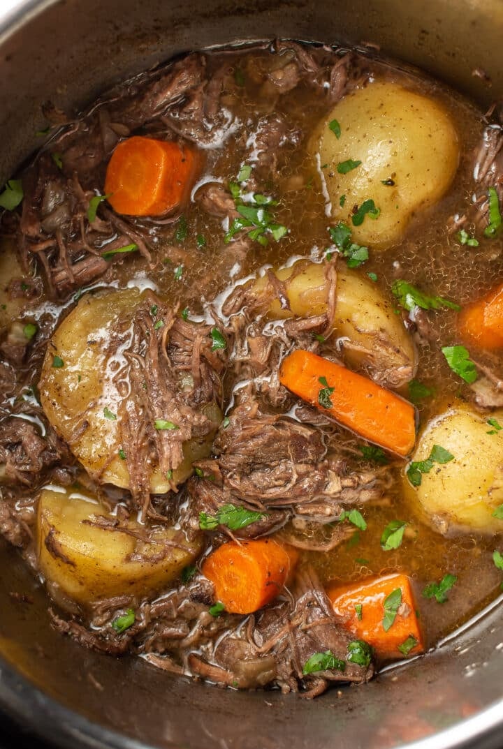 closeup of meat, potatoes, and carrots in an Instant Pot