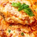 closeup of baked ricotta chicken with basil