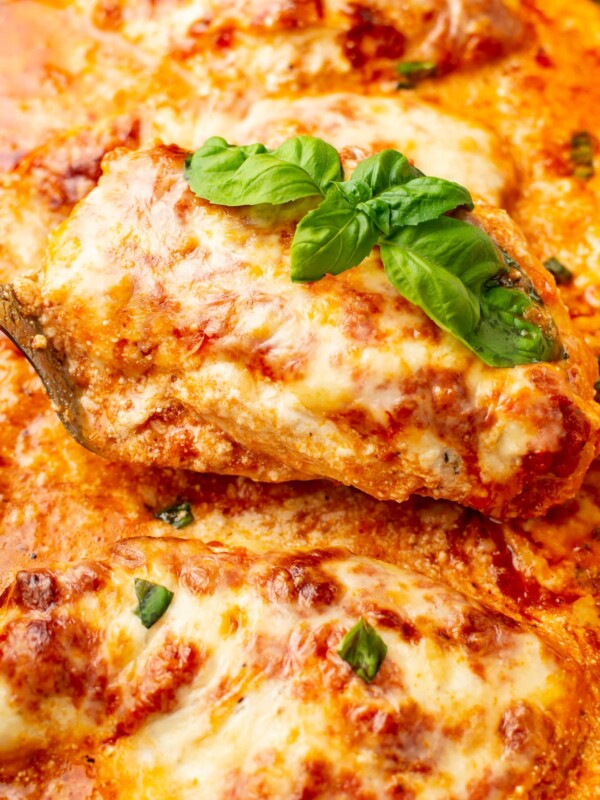 closeup of baked ricotta chicken with basil