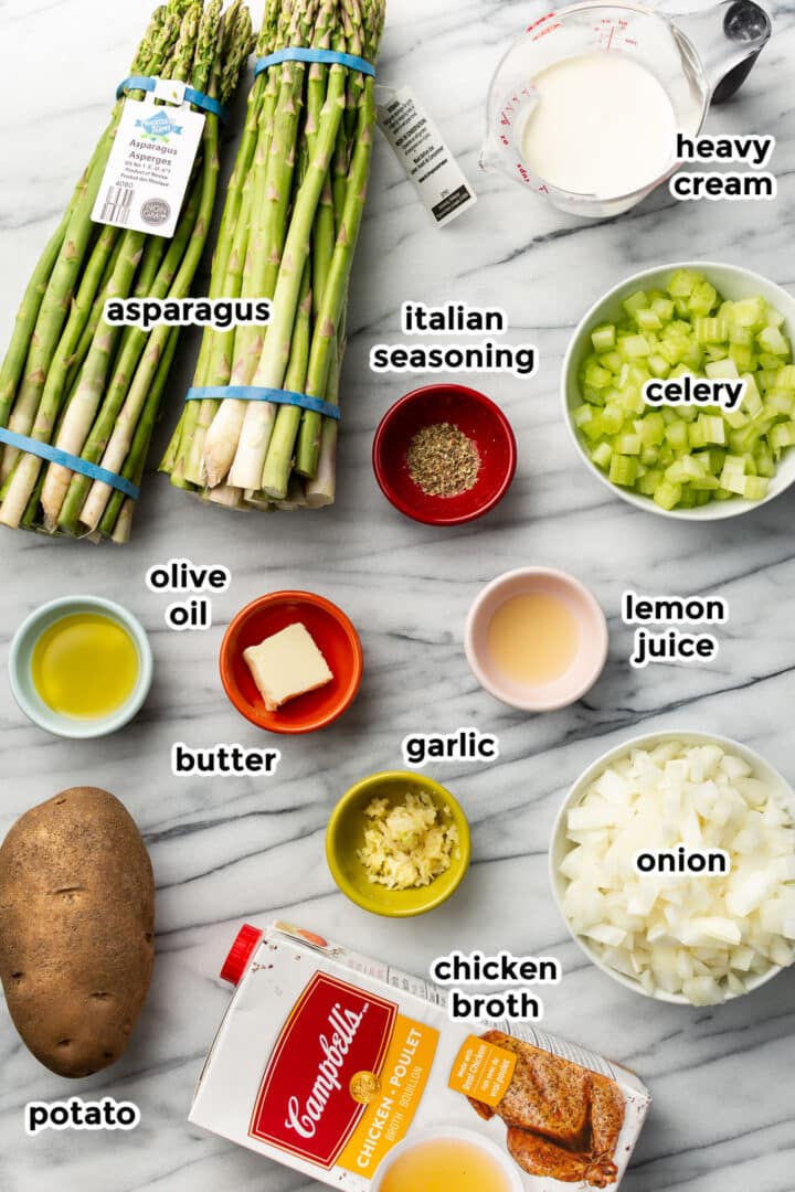 ingredients for asparagus soup on a marble counter
