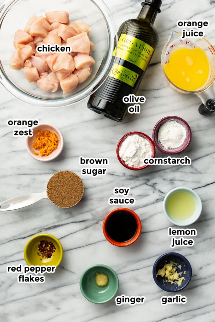 ingredients for orange chicken in prep bowls