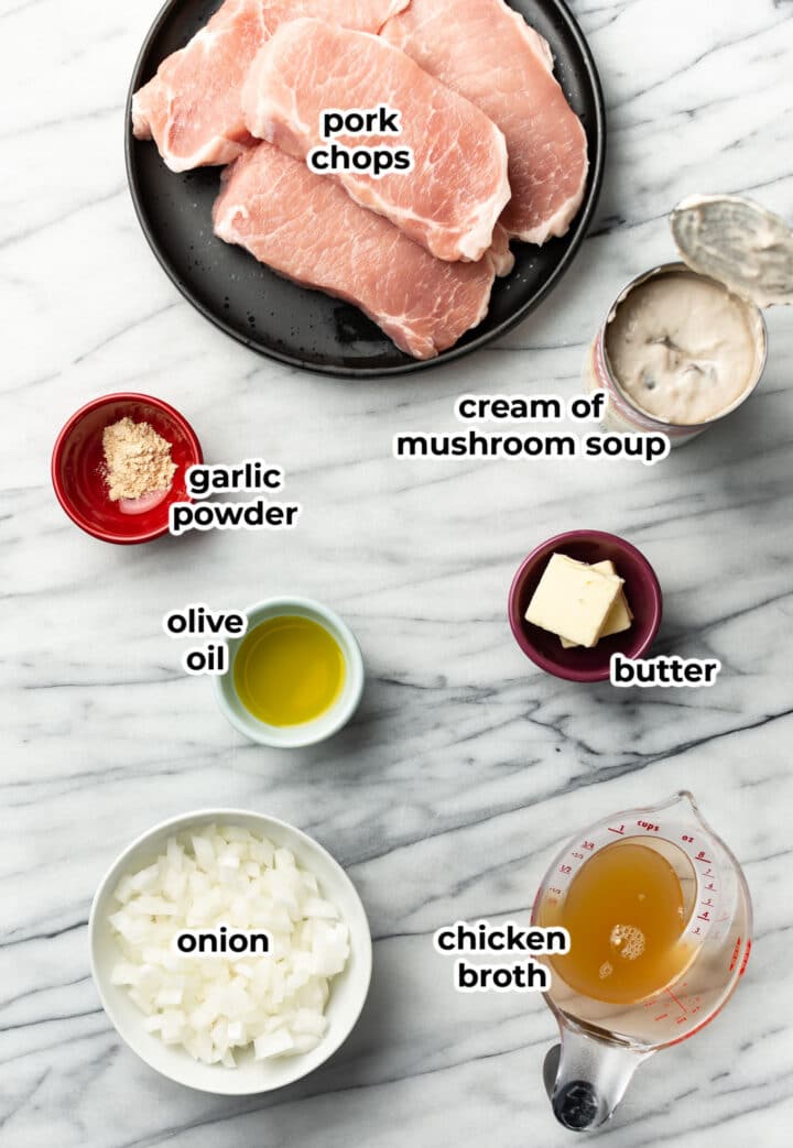 ingredients for cream of mushroom pork in prep bowls on a countertop