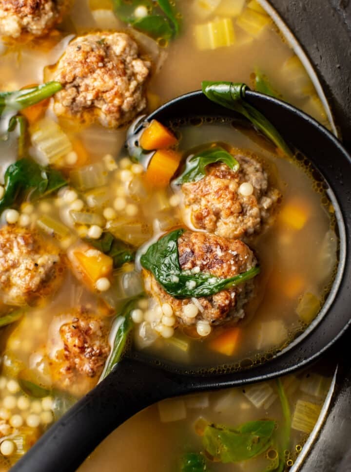 closeup of a ladle of italian wedding soup