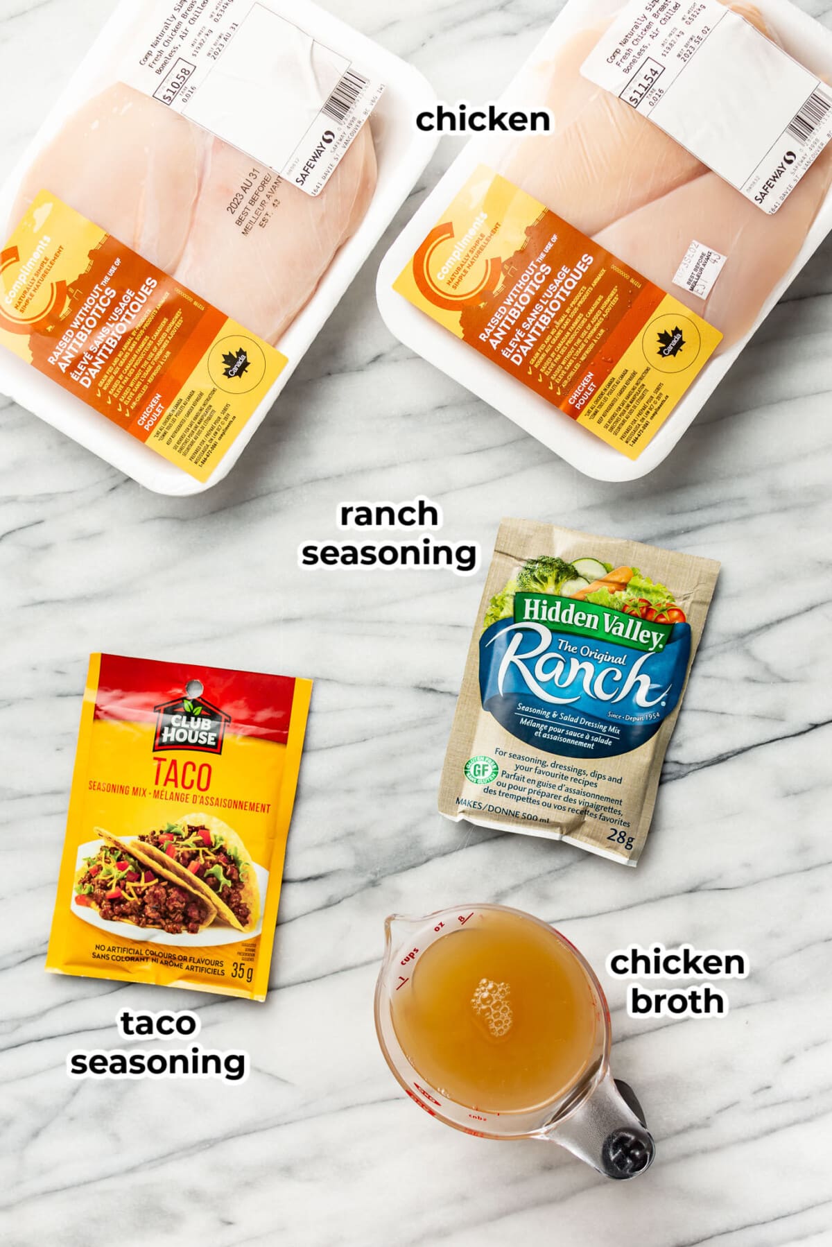 ingredients for crockpot ranch chicken tacos on a marble counter