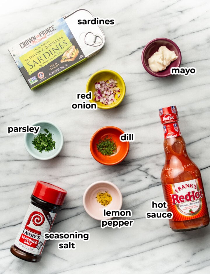 ingredients for sardine salad in prep bowls on a counter