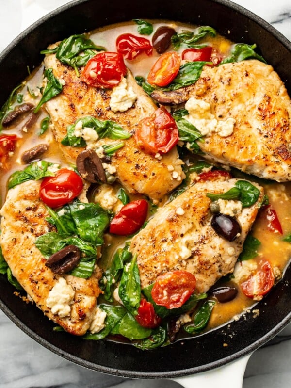 a skillet with mediterranean chicken