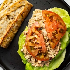 a plate with a sardine salad sandwich