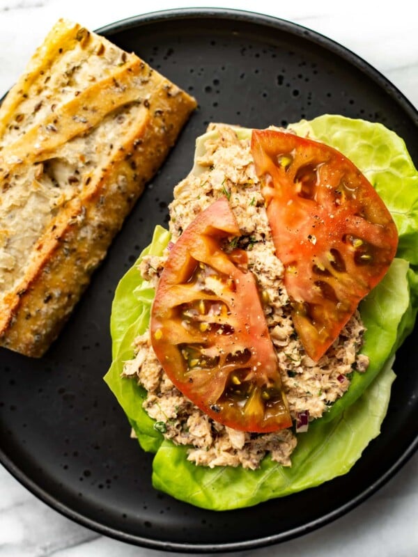 a plate with a sardine salad sandwich