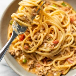 a bowl with taco spaghetti and a fork