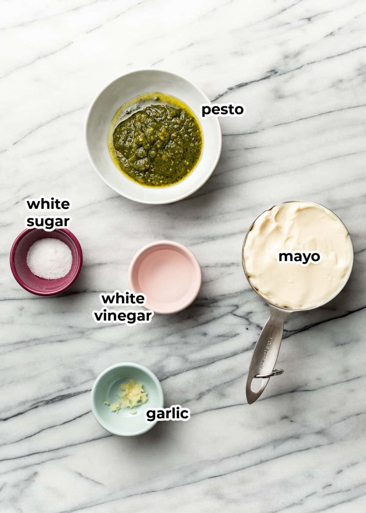 ingredients for creamy pesto dressing in prep bowls