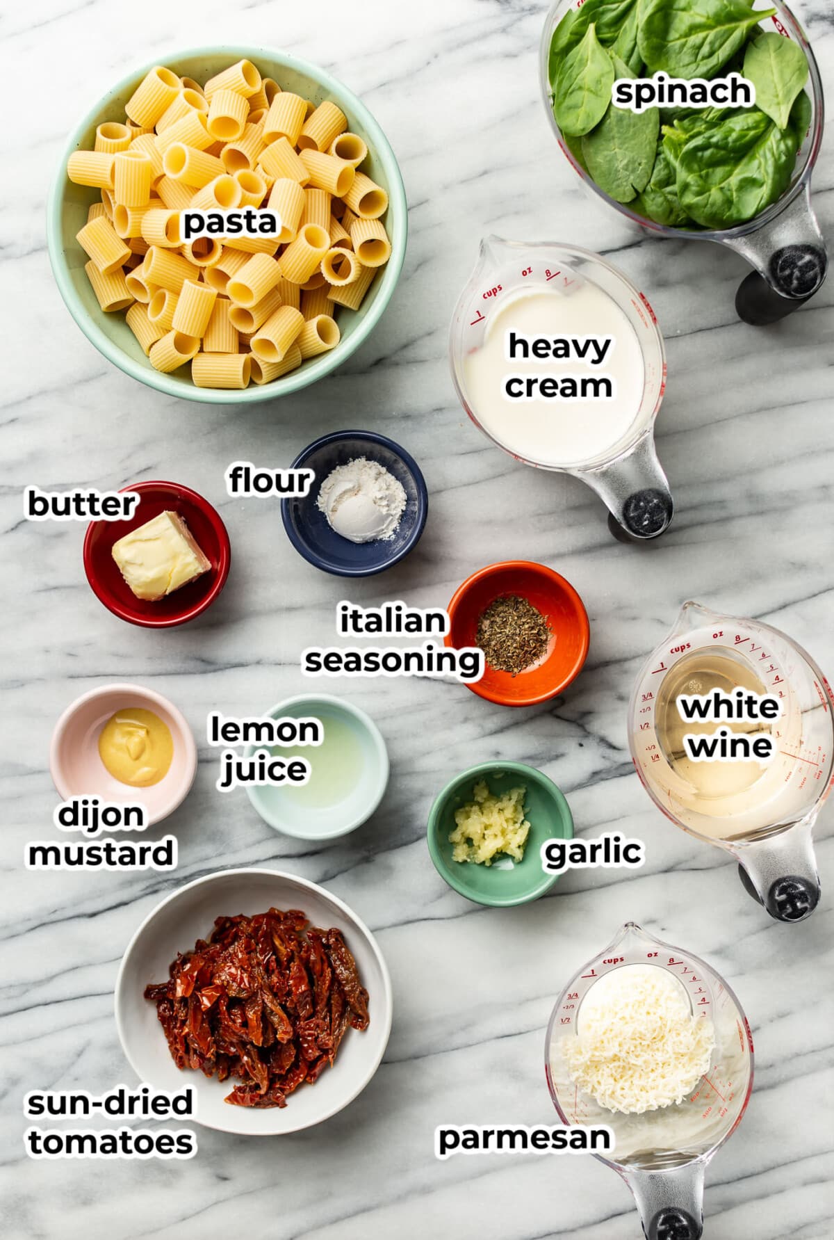 ingredients for sun dried tomato pasta in prep bowls