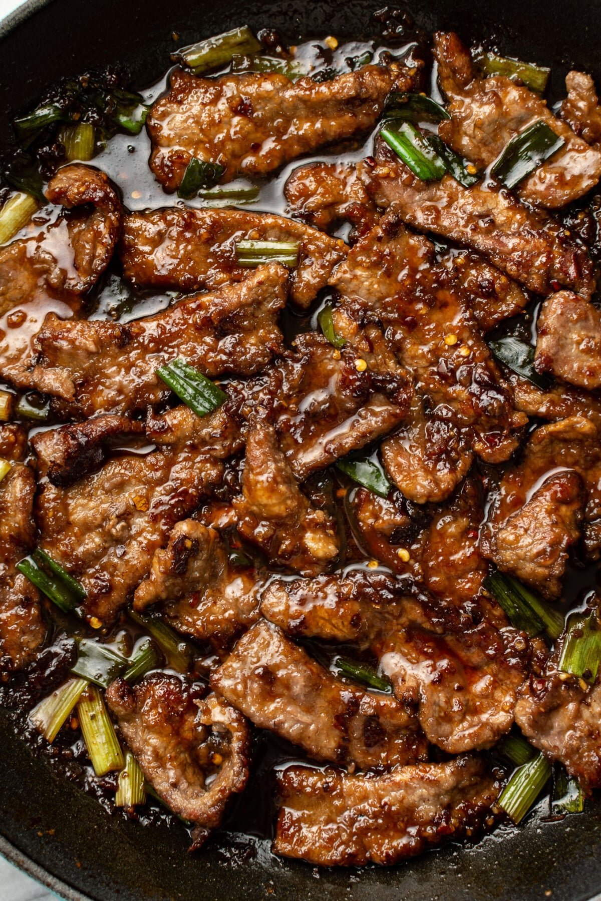 a skillet with mongolian beef