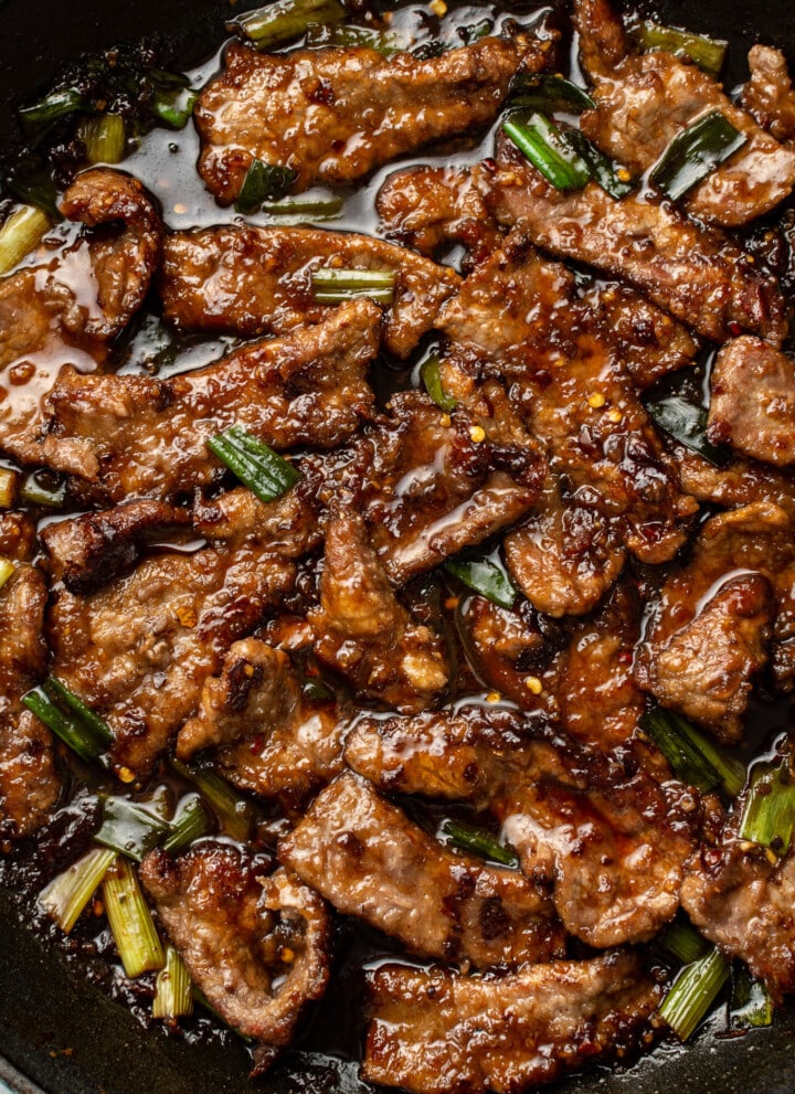 a skillet with mongolian beef