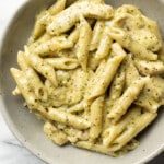 a bowl of creamy chicken pesto pasta