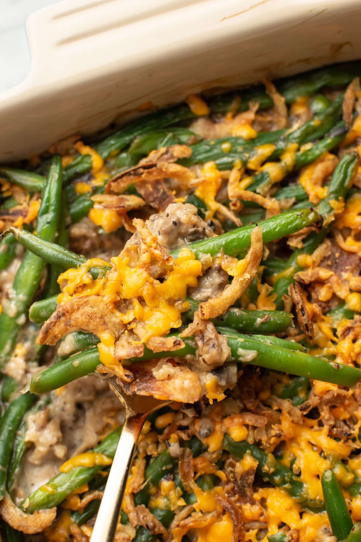 closeup of a serving spoon with green bean casserole