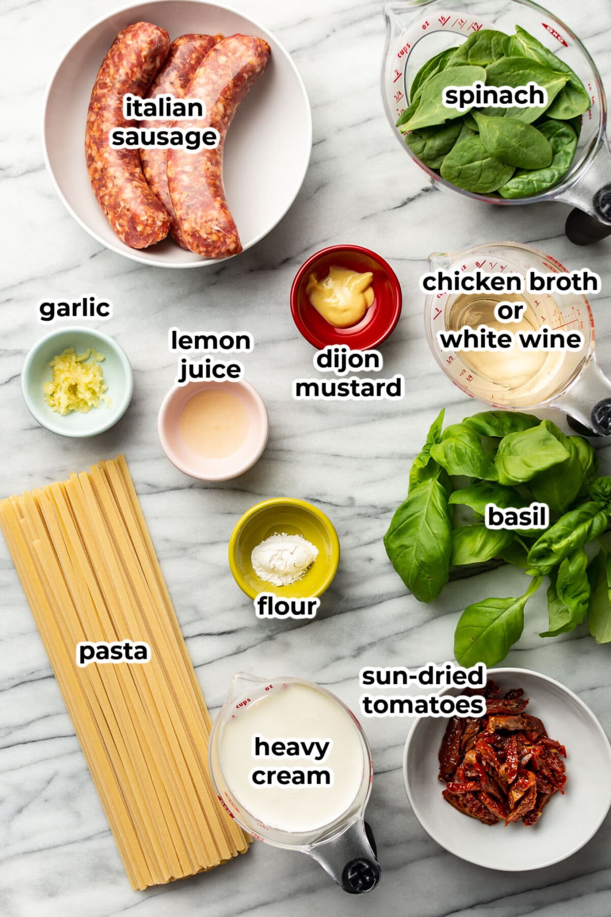 ingredients for tuscan sausage pasta in prep bowls