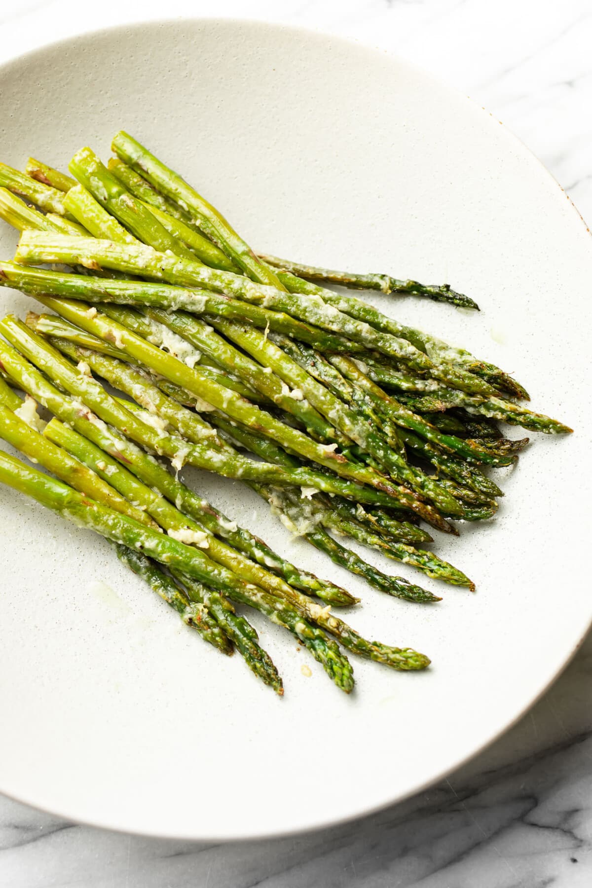 a bowl of parmesan roasted asparagus