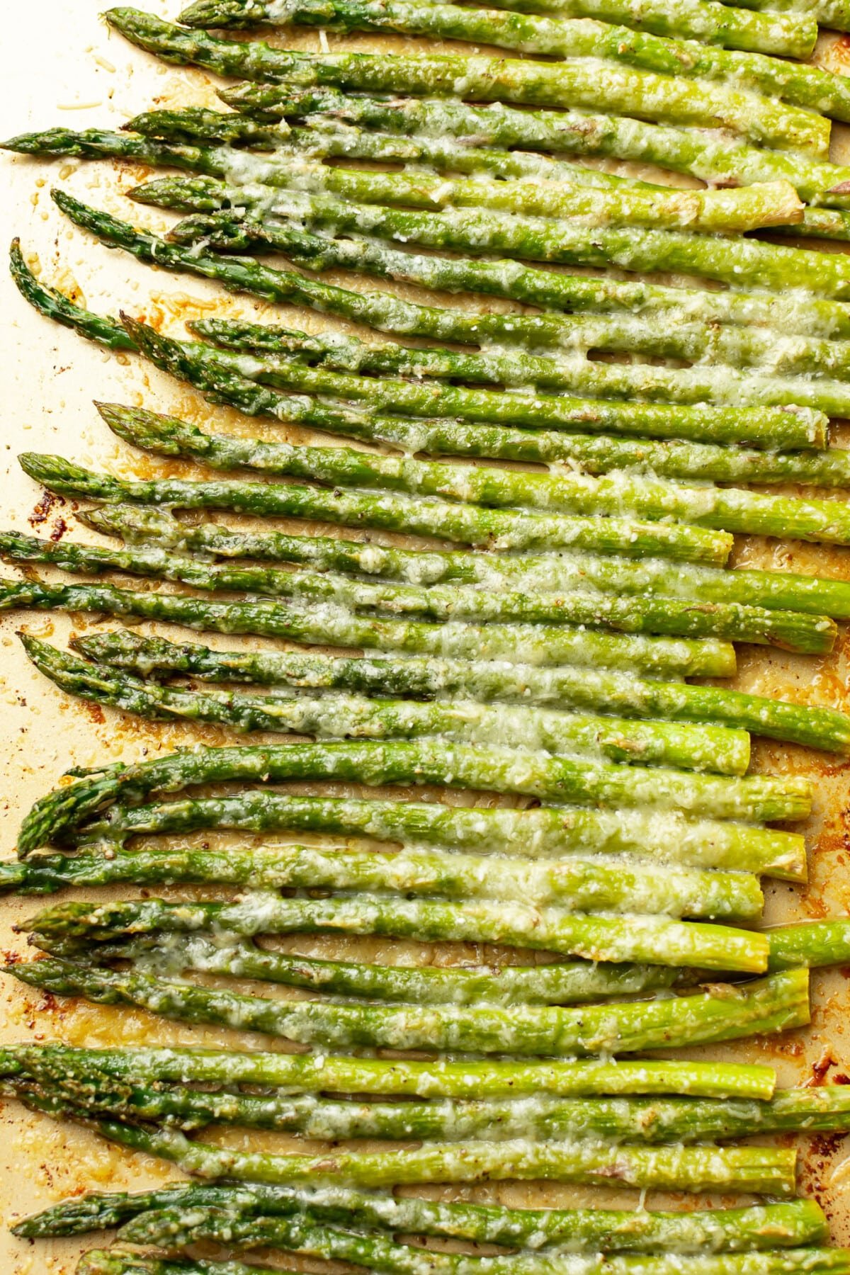 closeup of a baking sheet with roasted asparagus